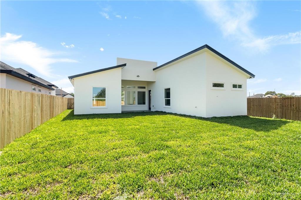 505 Freedom Way Weslaco, TX 78596 - Photo 11 of 20 a view of a backyard with potted plants