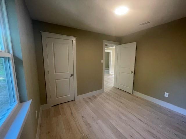 1631 Lcr 760 Groesbeck, TX 76642 - Photo 11 of 15 an empty room with wooden floor and windows