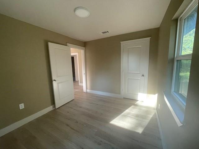 1631 Lcr 760 Groesbeck, TX 76642 - Photo 12 of 15 an empty room with wooden floor and windows