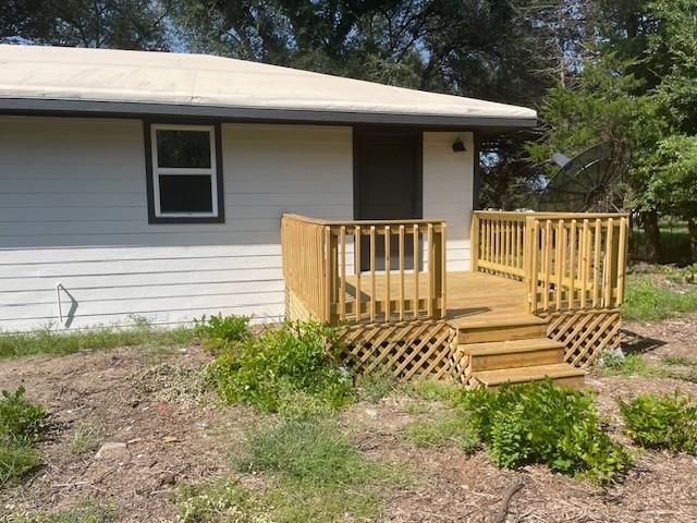 1631 Lcr 760 Groesbeck, TX 76642 - Photo 13 of 15 a side view of a house with a yard