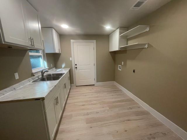 1631 Lcr 760 Groesbeck, TX 76642 - Photo 5 of 15 a kitchen with a sink and refrigerator