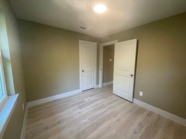 1631 Lcr 760 Groesbeck, TX 76642 - Photo 10 of 15 an empty room with wooden floor and windows