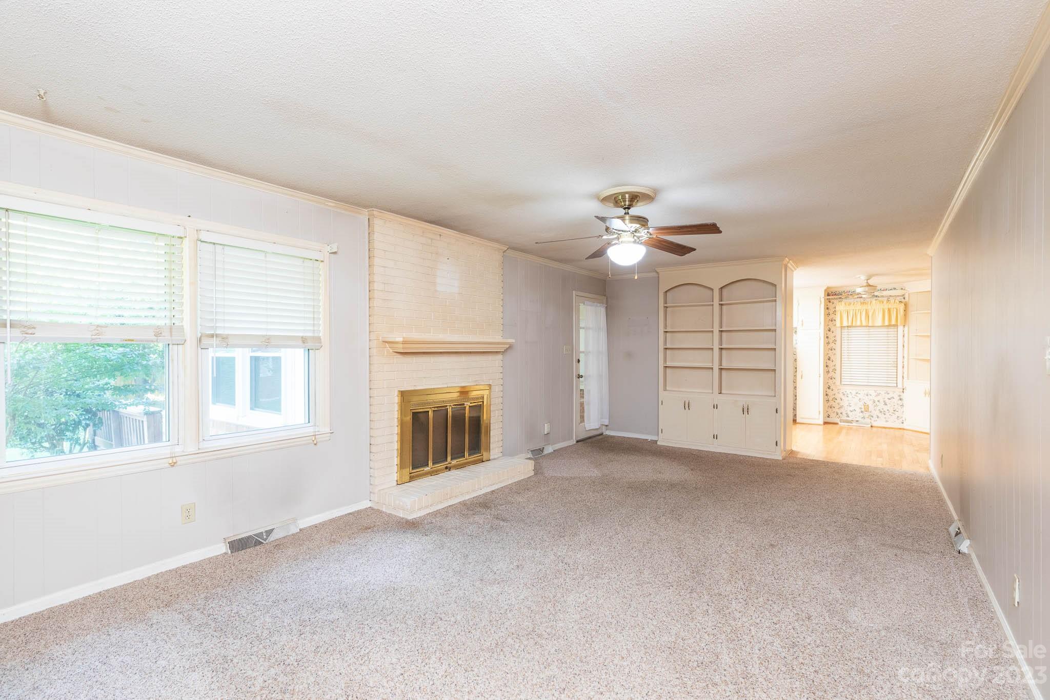 480 Plantation Road Rock Hill, SC 29732 - Photo 4 of 31 an empty room with chandelier fan and windows