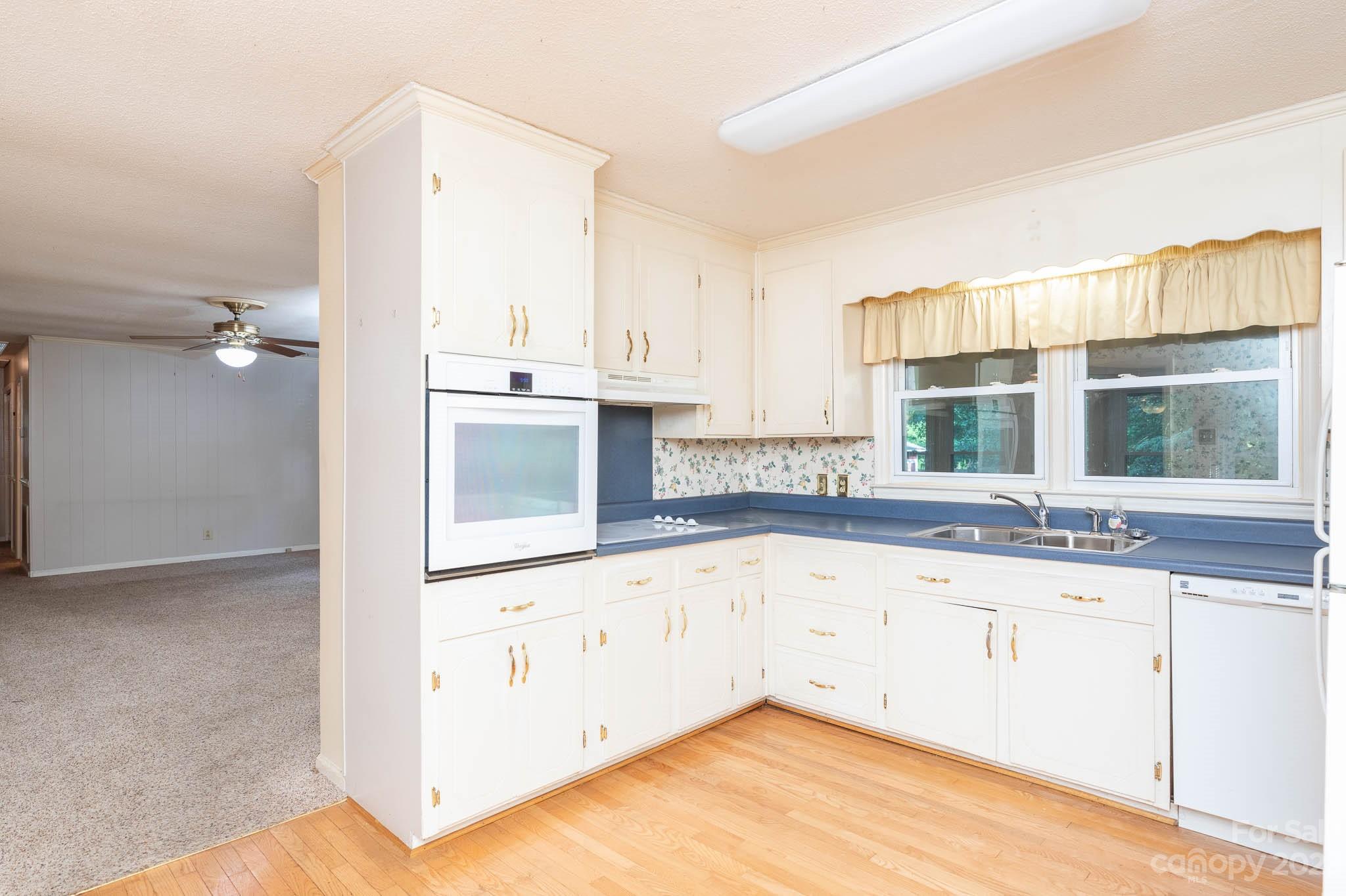 480 Plantation Road Rock Hill, SC 29732 - Photo 6 of 31 a view of a kitchen with granite countertop white cabinets and a sink