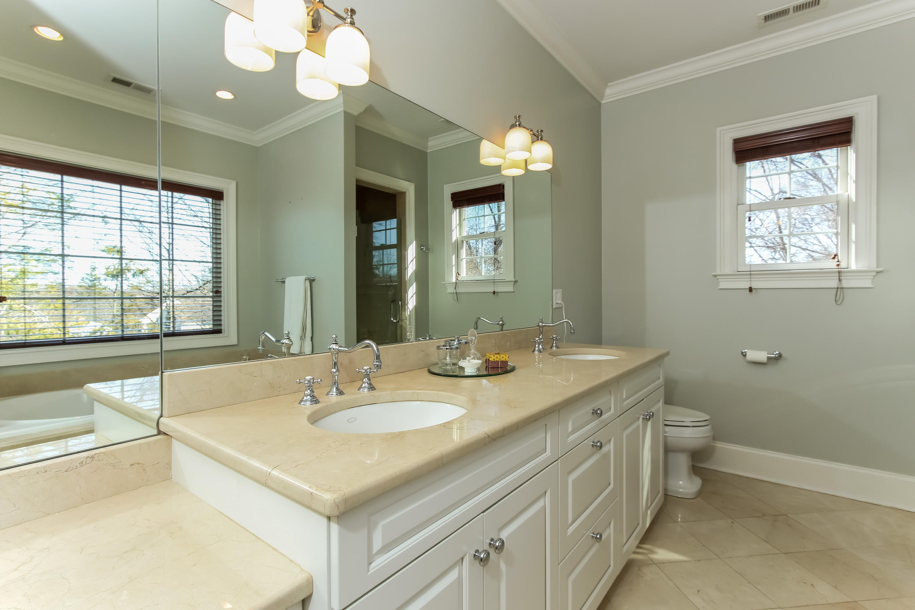 221 Hollow Tree Ridge Road Darien, CT 06820 - Photo 14 of 28 a bathroom with a sink double vanity granite and a toilet