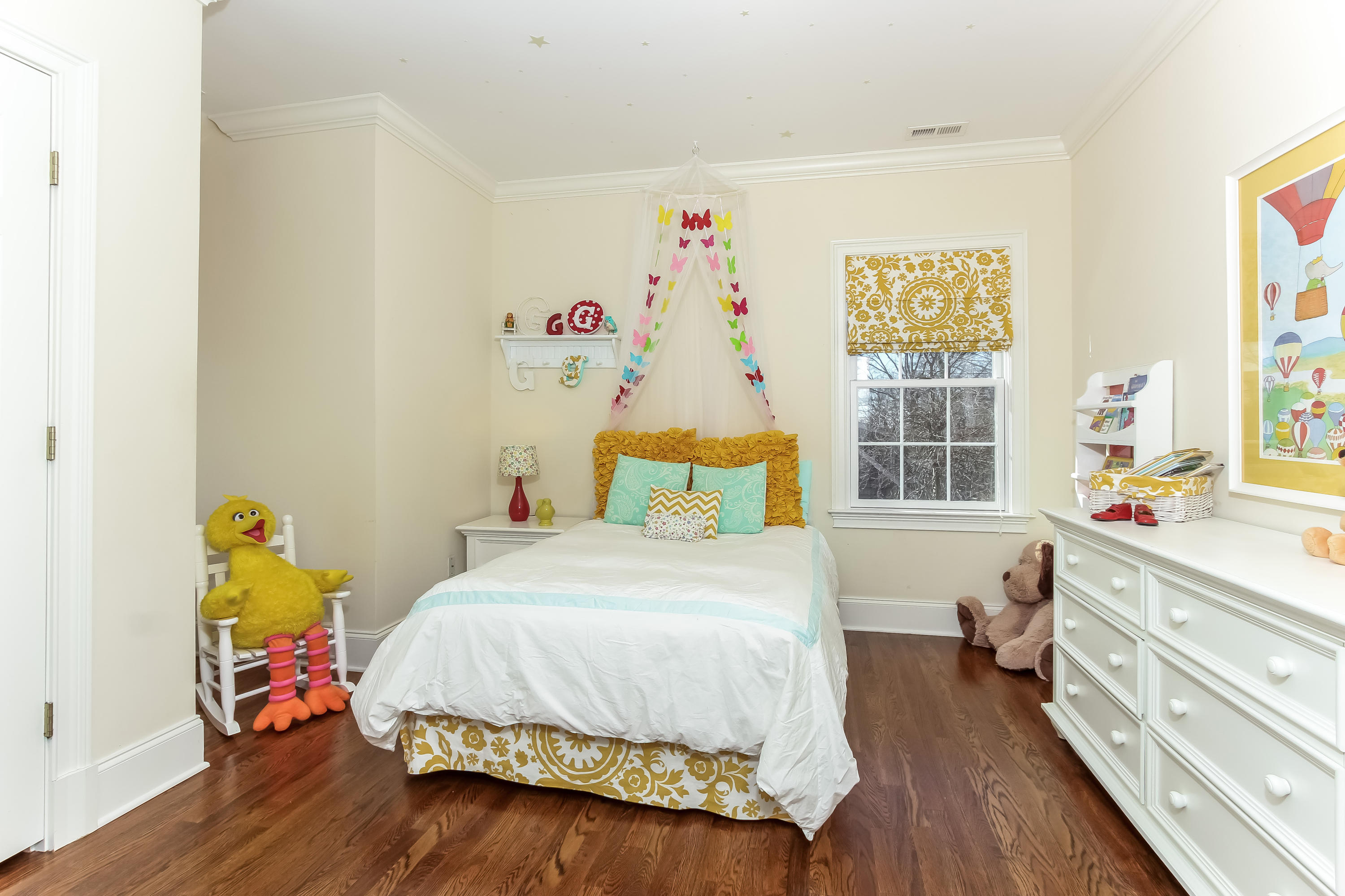 221 Hollow Tree Ridge Road Darien, CT 06820 - Photo 16 of 28 a bedroom with a bed and a table in it