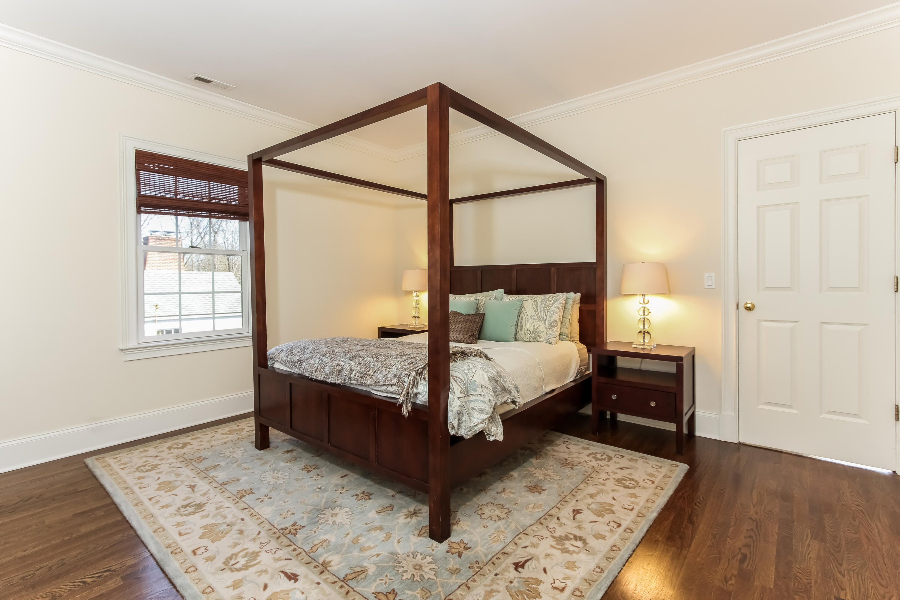 221 Hollow Tree Ridge Road Darien, CT 06820 - Photo 19 of 28 a bedroom with a bed and a window