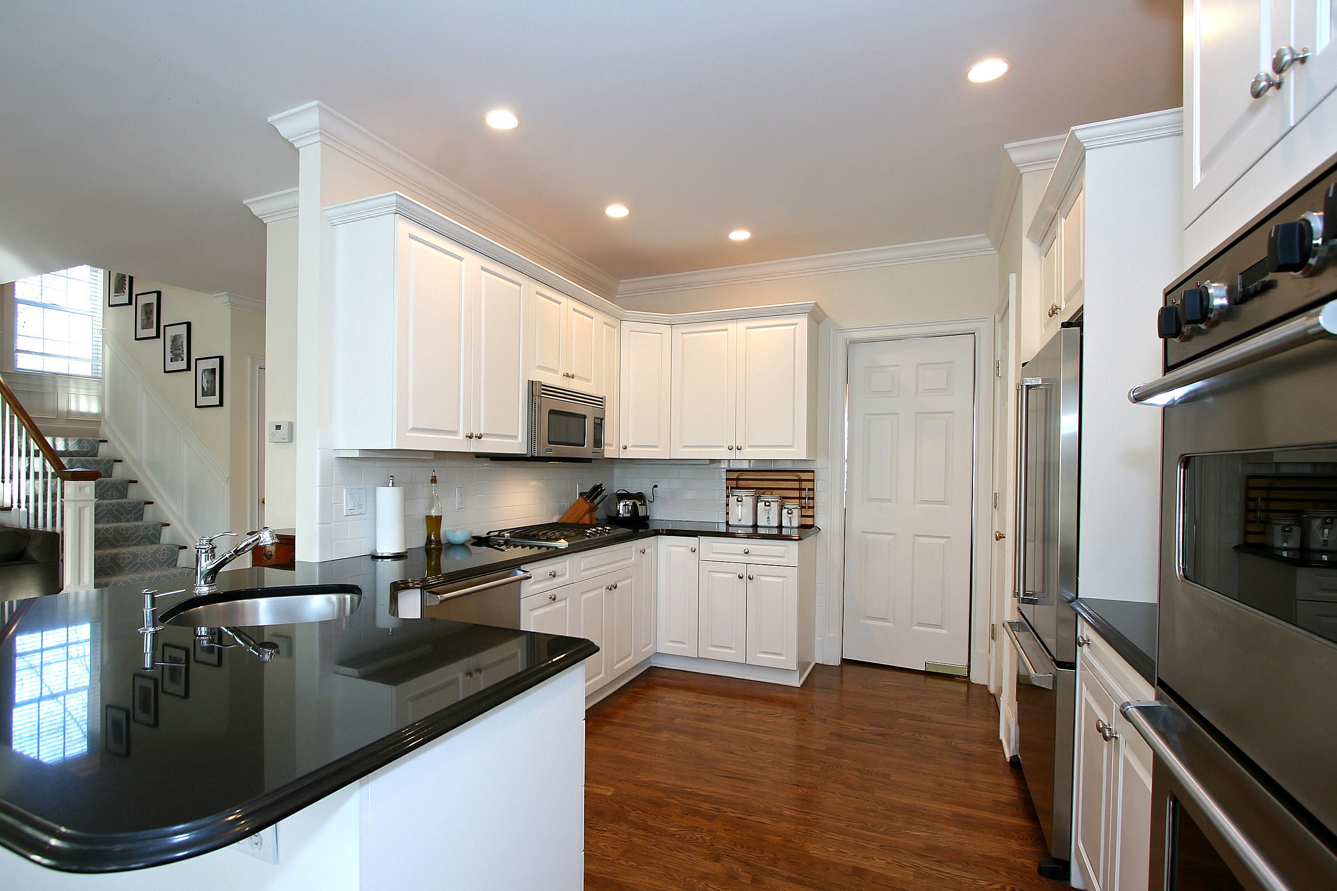221 Hollow Tree Ridge Road Darien, CT 06820 - Photo 28 of 28 a kitchen with stainless steel appliances granite countertop a sink a stove and a refrigerator
