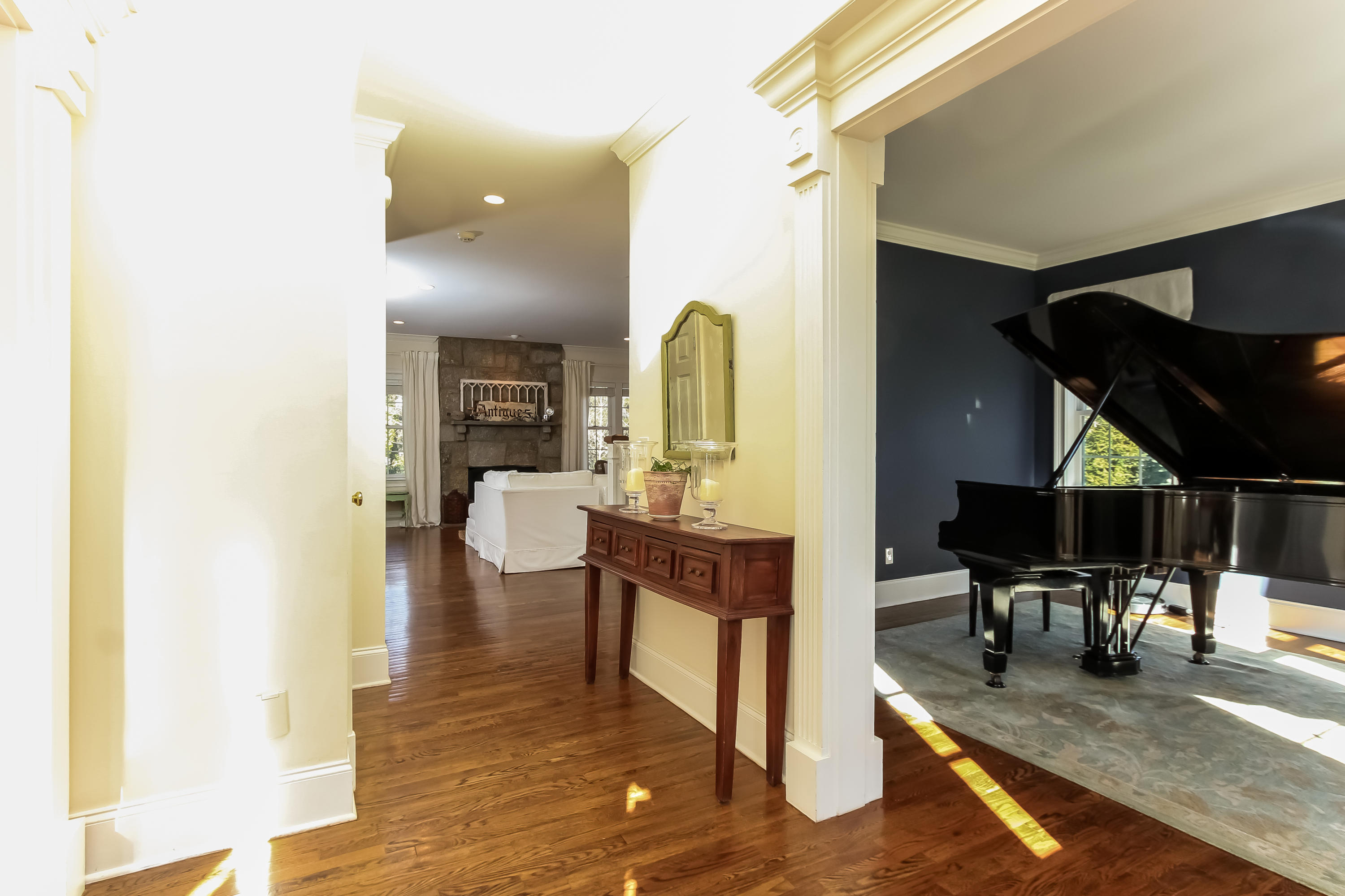 221 Hollow Tree Ridge Road Darien, CT 06820 - Photo 6 of 28 a living room with dining table and wooden floor