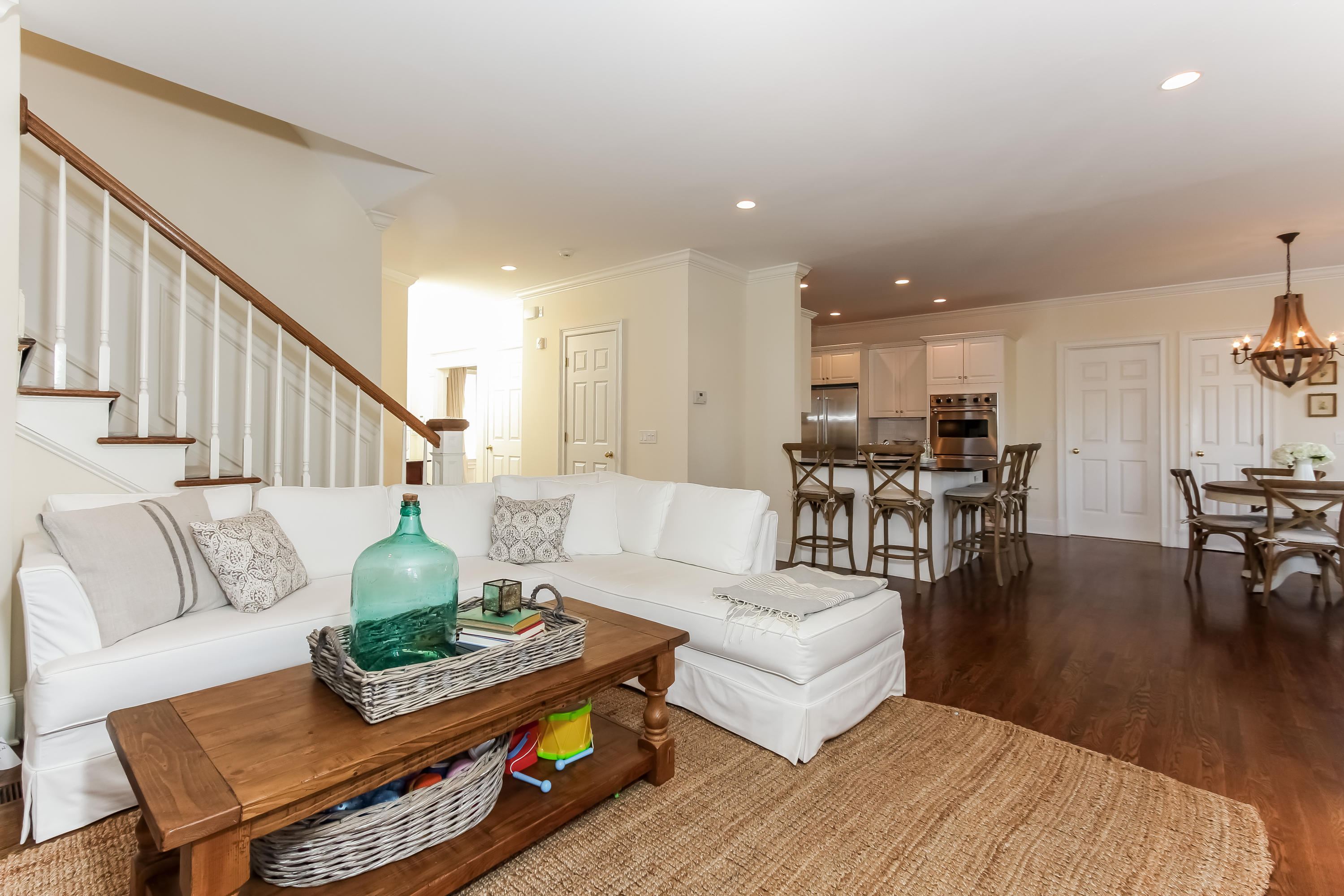 221 Hollow Tree Ridge Road Darien, CT 06820 - Photo 7 of 28 a living room with furniture and a dining table with wooden floor