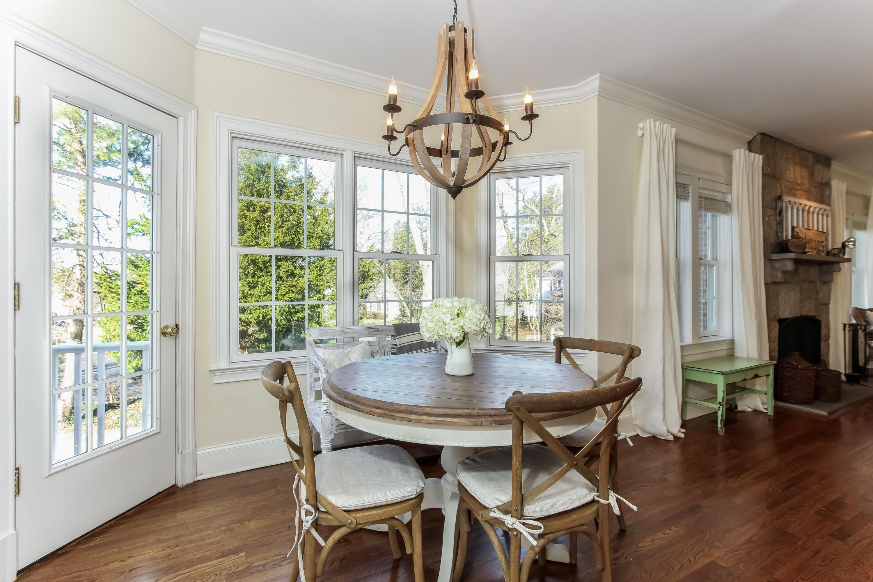 221 Hollow Tree Ridge Road Darien, CT 06820 - Photo 9 of 28 a view of a dining room with furniture window and wooden floor