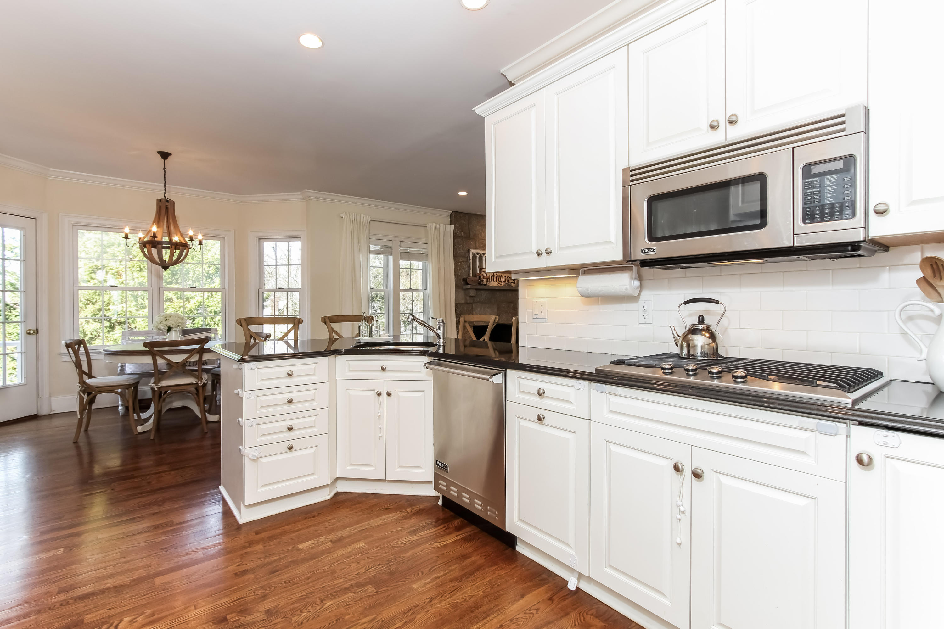 221 Hollow Tree Ridge Road Darien, CT 06820 - Photo 10 of 28 a kitchen with stainless steel appliances granite countertop a stove a sink and a microwave