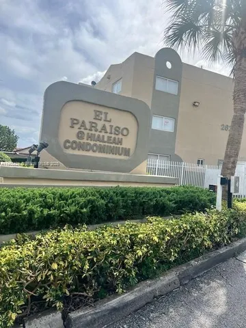 a view of a room with wooden floor and windows