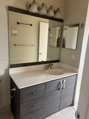 a bathroom with a sink and toilet