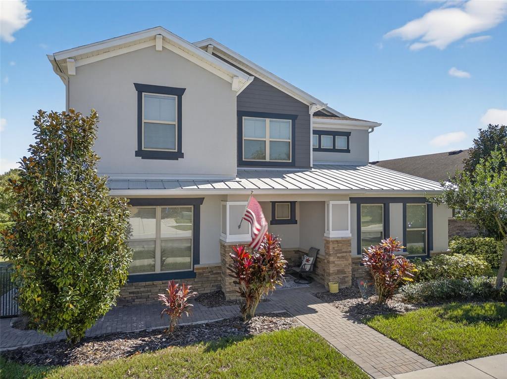 5706 Esker Falls Lane Lithia, FL 33547 - Photo 4 of 76 a front view of a house with garden