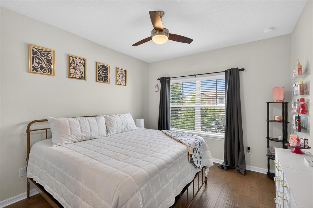 5706 Esker Falls Lane Lithia, FL 33547 - Photo 43 of 76 a bedroom with a bed and a large window