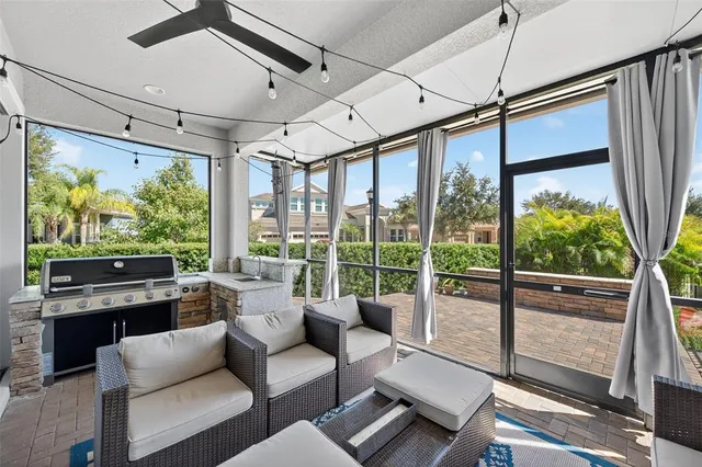 a view of a patio with table and chairs and wooden floor