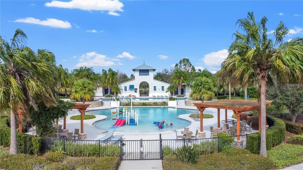 5706 Esker Falls Lane Lithia, FL 33547 - Photo 61 of 76 a view of a swimming pool with a patio