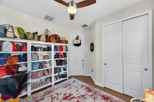 a living room with furniture and a dresser