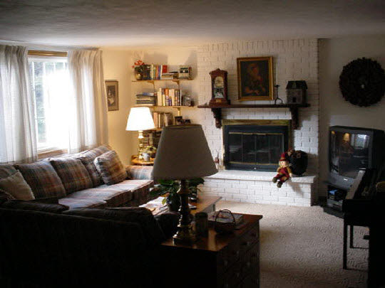 4851 Welsh Road Rockford, IL 61107 - Photo 2 of 6 a living room with furniture and a fireplace