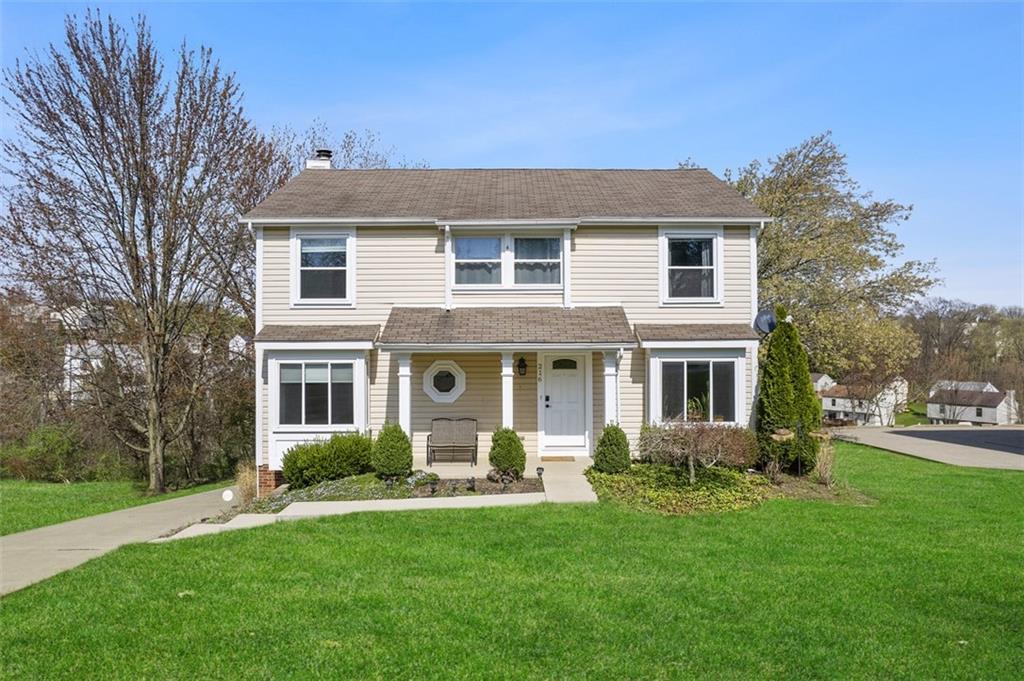 front view of a house with a yard