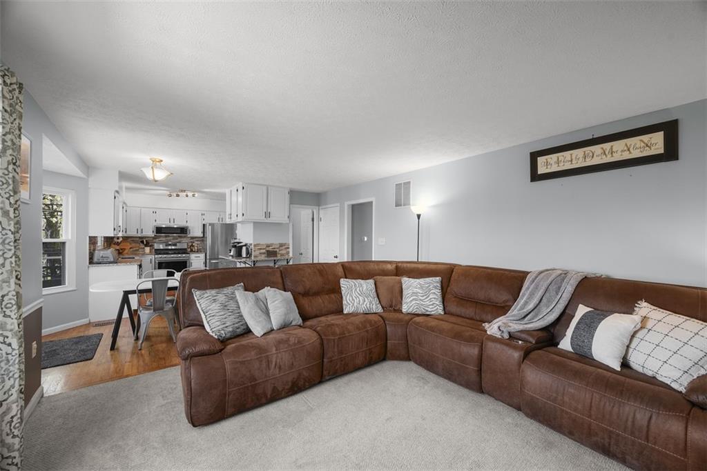 216 Briar Path Imperial, PA 15126 - Photo 12 of 39 a living room with furniture and a view of kitchen