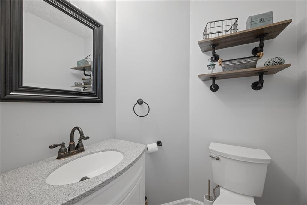 216 Briar Path Imperial, PA 15126 - Photo 13 of 39 a bathroom with a sink a toilet and a mirror