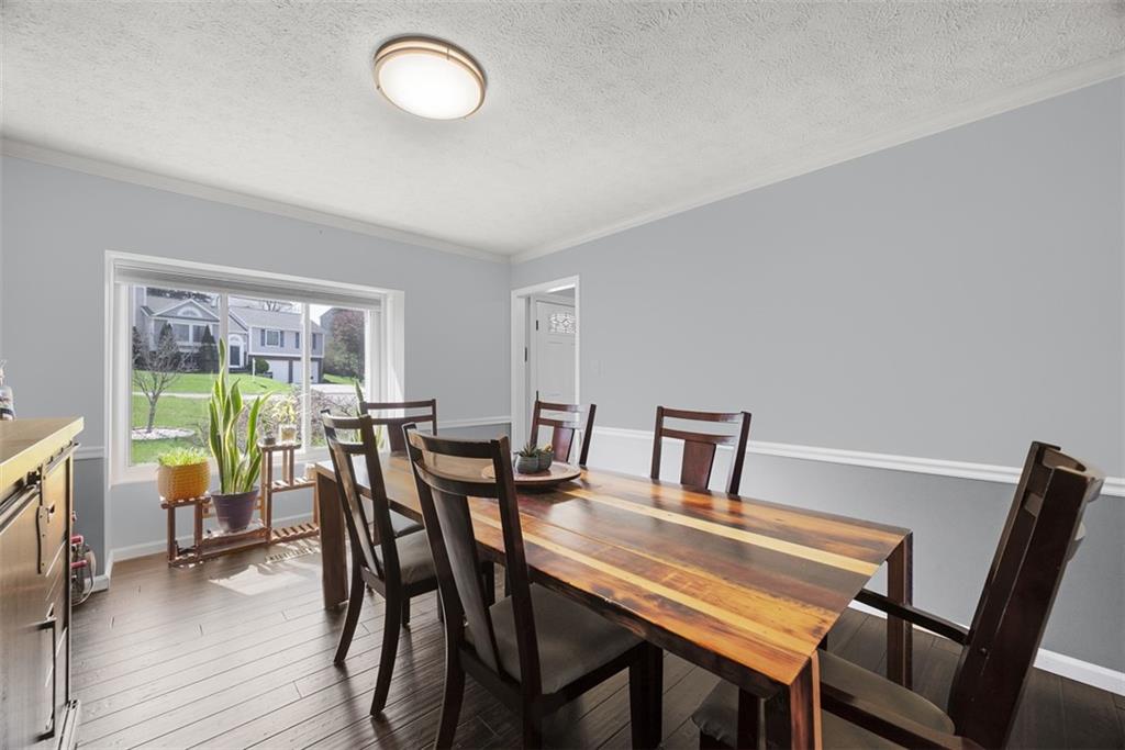 216 Briar Path Imperial, PA 15126 - Photo 14 of 39 a view of a dining room with furniture and a potted plant