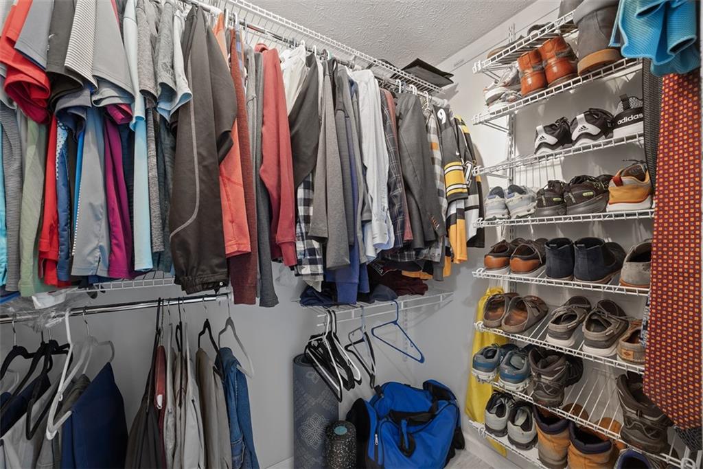 216 Briar Path Imperial, PA 15126 - Photo 22 of 39 a view of walk in closet with clothes and shoes