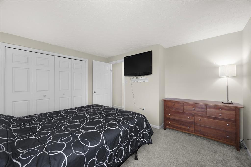 216 Briar Path Imperial, PA 15126 - Photo 28 of 39 a bedroom with a bed and a flat screen tv