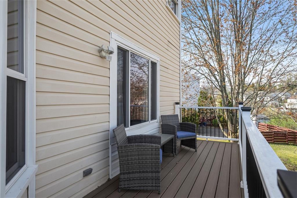 216 Briar Path Imperial, PA 15126 - Photo 36 of 39 a view of deck with table and chairs and wooden floor