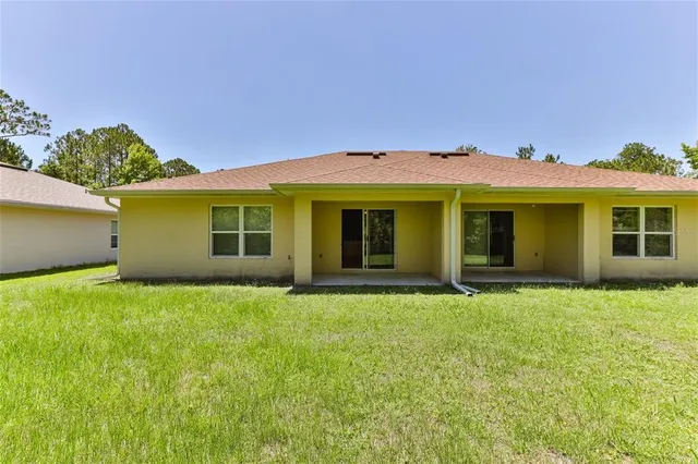 a view of a house with a garden