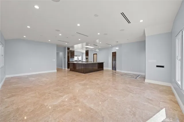 a view of kitchen and refrigerator