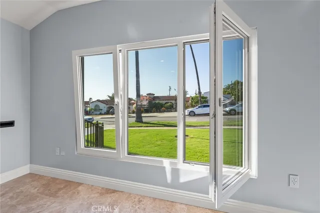 a view of a room that has a large window