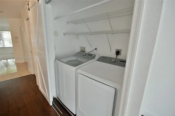 a utility room with dryer and washer