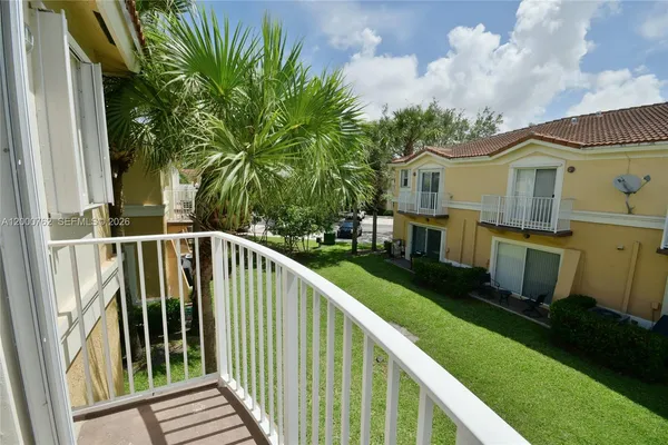 a view of a house with a small yard