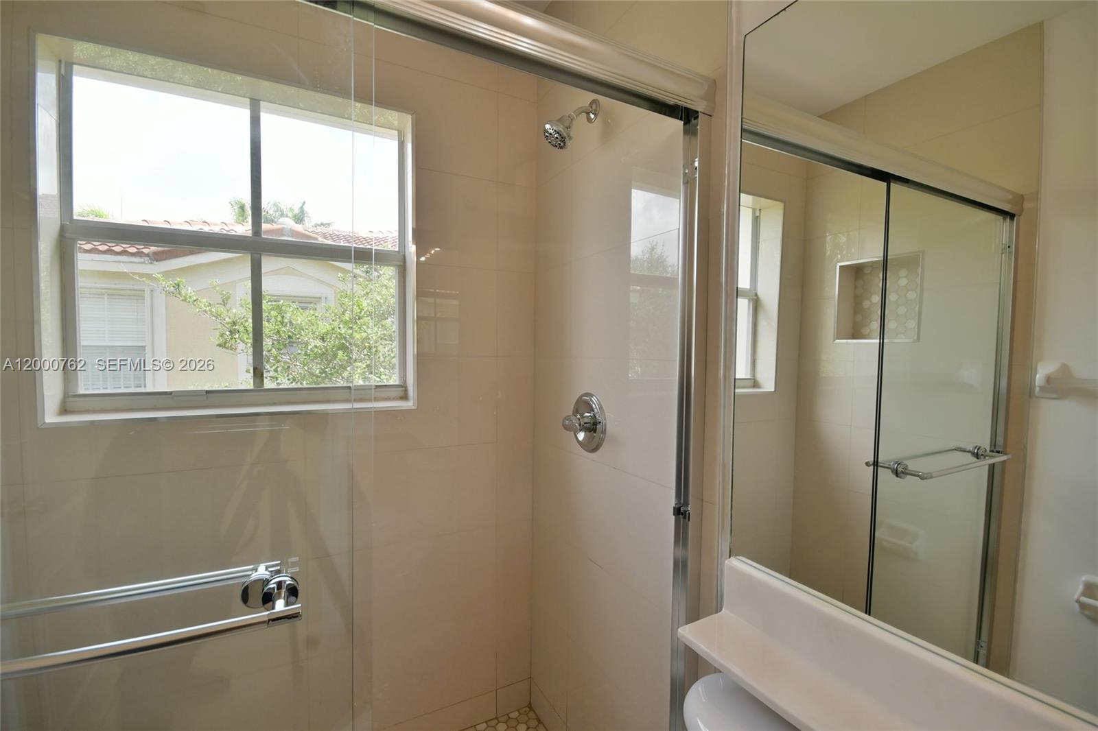 3177 Southwest 129th Way, Unit 134 Miramar, FL 33027 - Photo 21 of 34 a bathroom with a shower and a sink