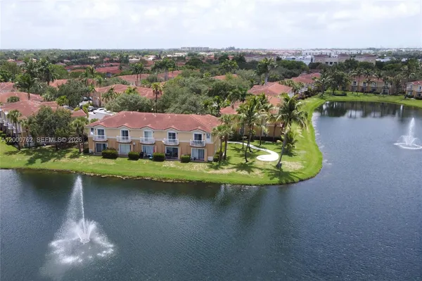 an aerial view of a house with a lake view