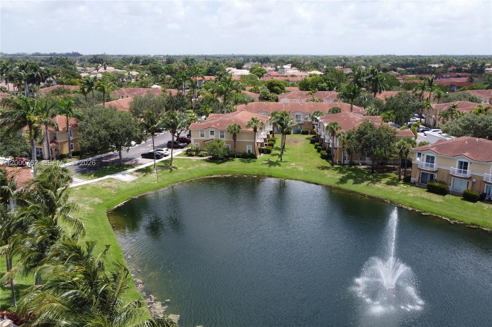 3177 Southwest 129th Way, Unit 134 Miramar, FL 33027 - Photo 28 of 34 an aerial view of a house with a yard and lake view