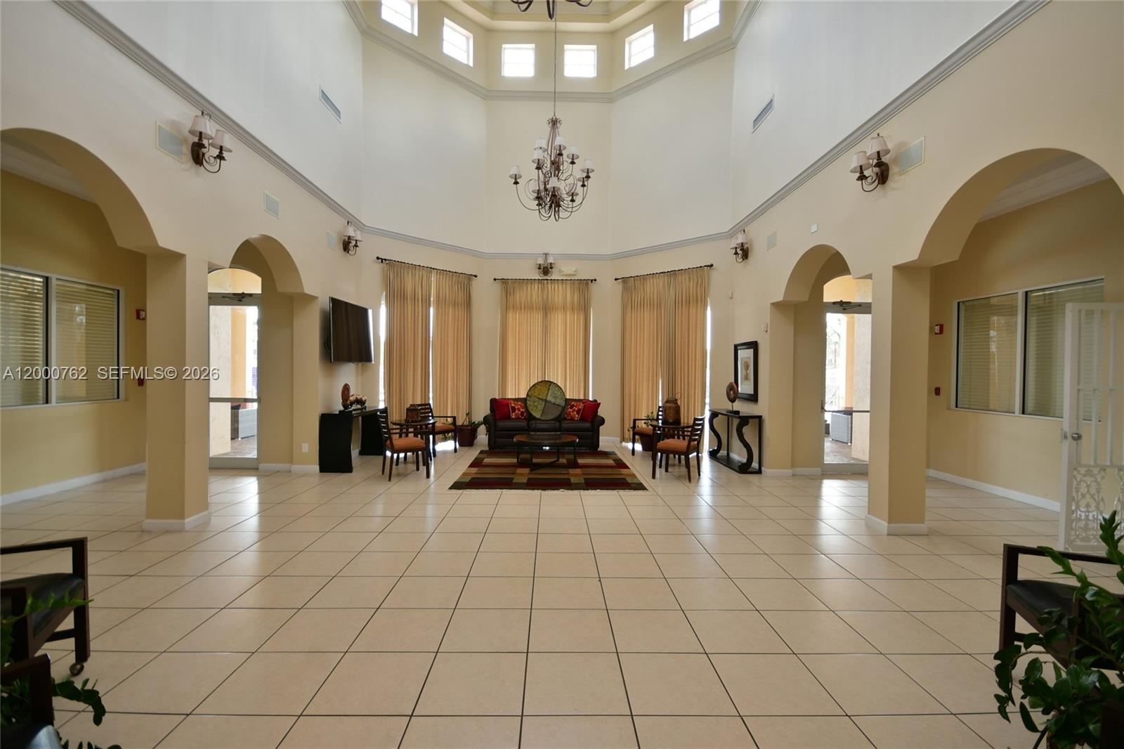 3177 Southwest 129th Way, Unit 134 Miramar, FL 33027 - Photo 29 of 34 a lobby with furniture and a chandelier