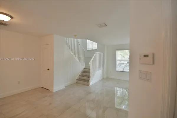 a view of an empty room with a window