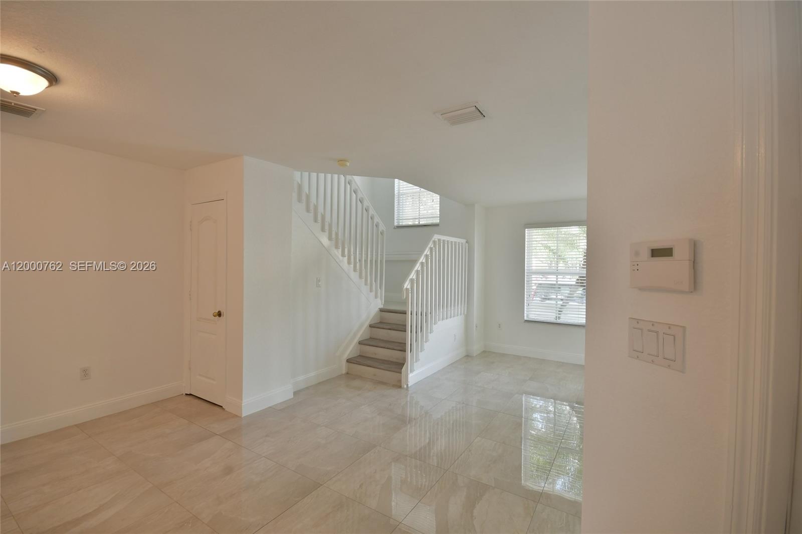 3177 Southwest 129th Way, Unit 134 Miramar, FL 33027 - Photo 3 of 34 a view of an empty room with a window