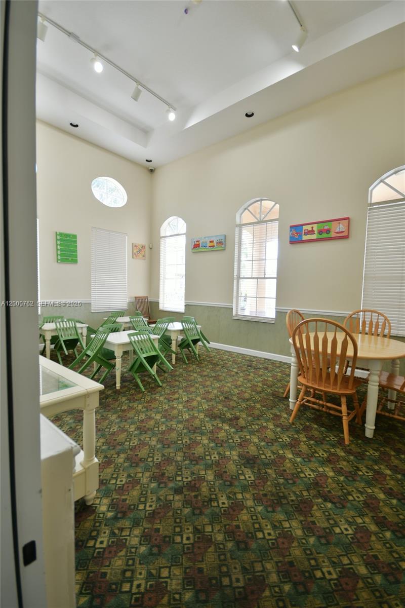3177 Southwest 129th Way, Unit 134 Miramar, FL 33027 - Photo 31 of 34 a living room with furniture and a window