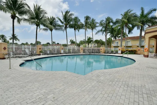 a view of a swimming pool and a chair
