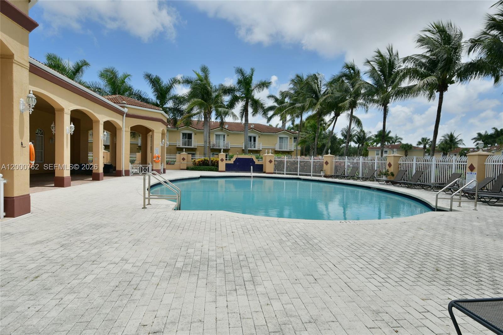 3177 Southwest 129th Way, Unit 134 Miramar, FL 33027 - Photo 34 of 34 a view of swimming pool with palm trees
