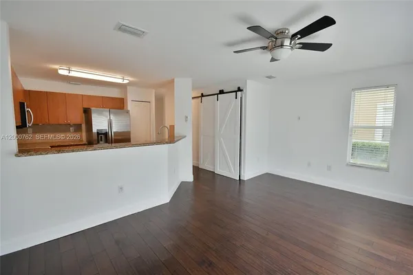 a view of a kitchen cabinets and a wooden floor