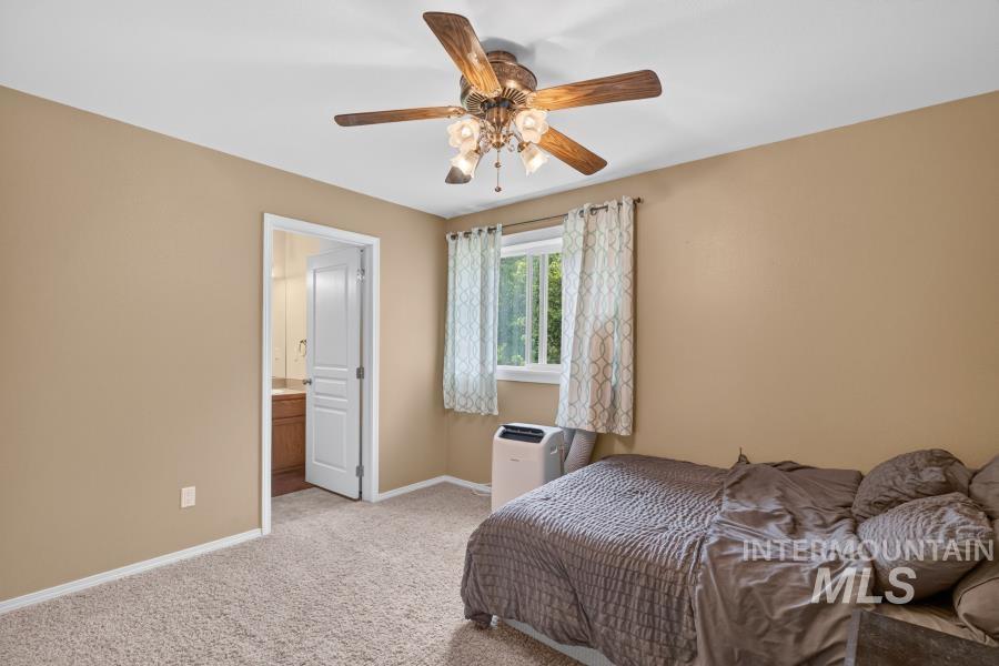1337 Bristol Road Moscow, ID 83843 - Photo 17 of 28 Carpeted room featuring a ceiling fan with integrated lighting, a window with natural light, and a white interior door