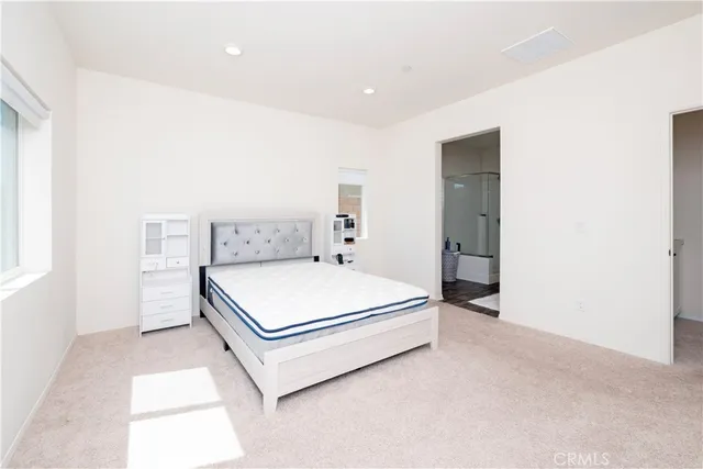 a room with a bed and a window