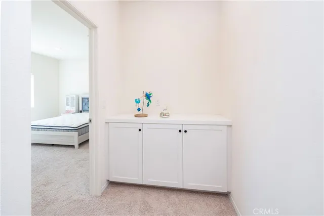 a living room with furniture and a mirror