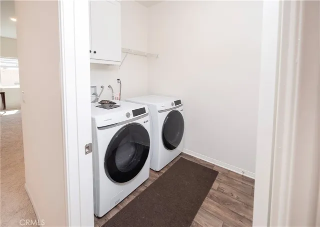 a view of hallway with wooden floor
